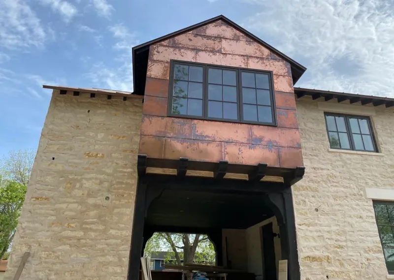 Copper metal panel facade on a stone building for Metal Roof Coating in Picnic Point