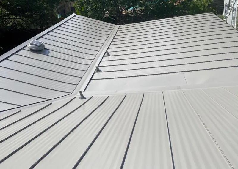 Solar attic fan installed on a metal roof for Roof Ventilation in Picnic Point